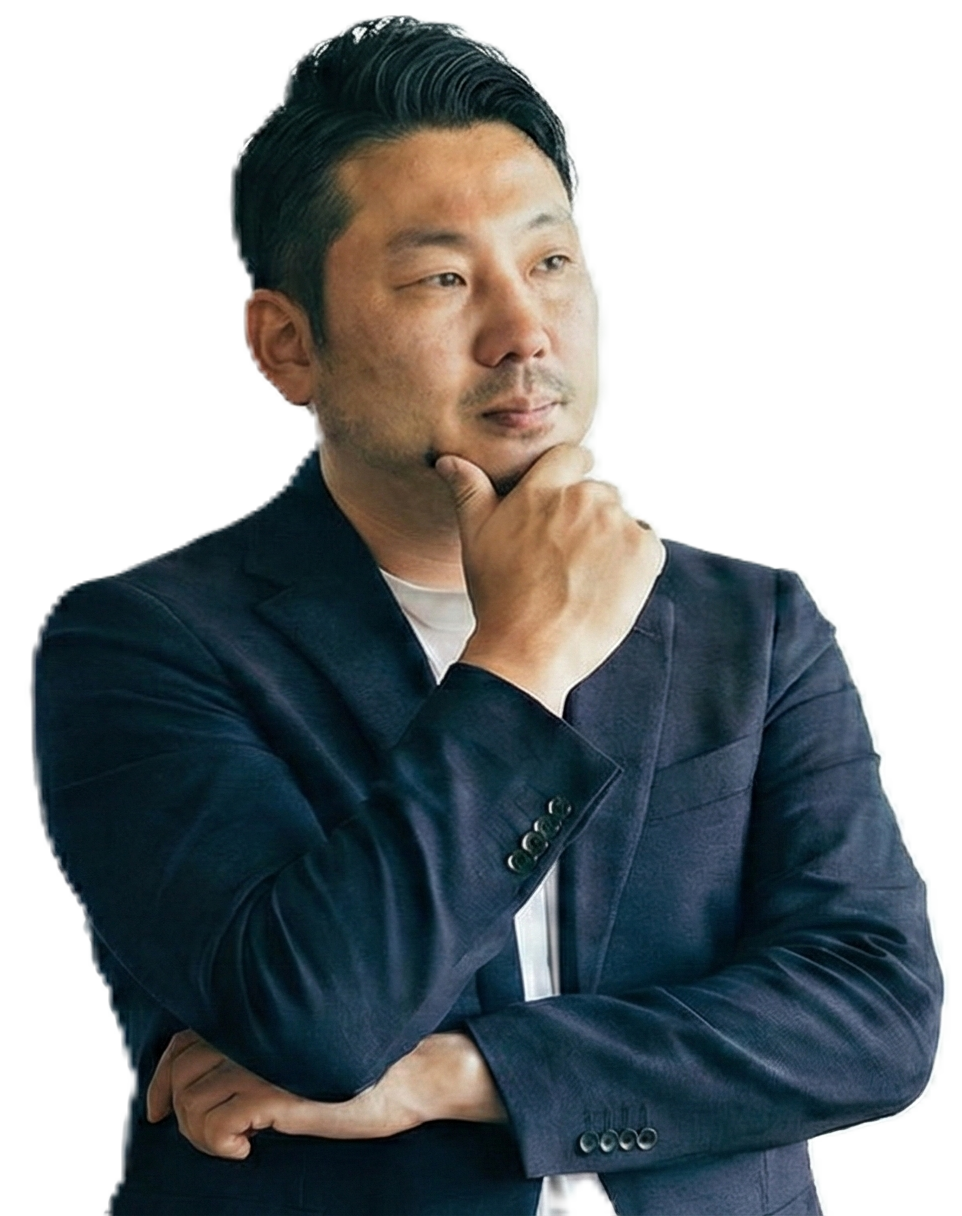 考えながら提案を練る田中康志